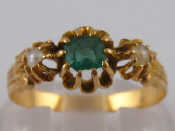 Appraisal: A French hallmarked carat gold emerald and cultured pearl ring