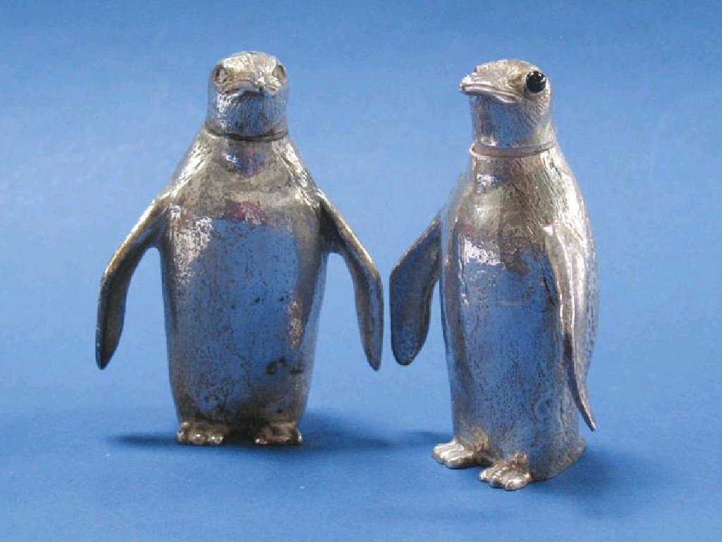 Appraisal: A PAIR OF NOVELTY CONDIMENTS in the form of penguins