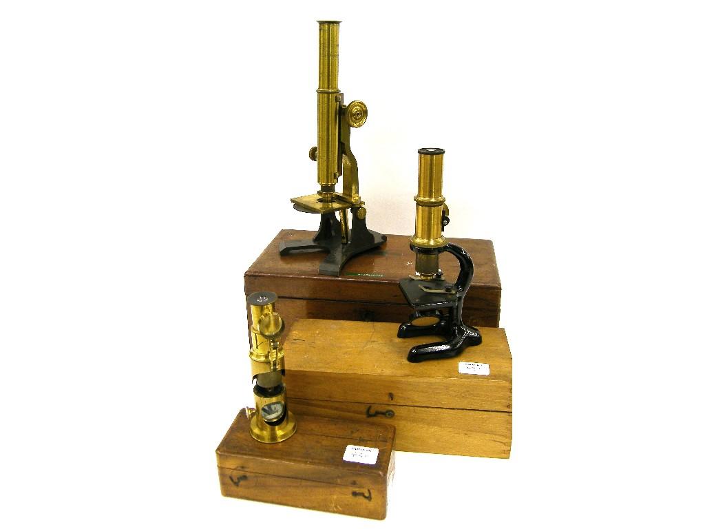 Appraisal: Brass monocular microscope high with a mahogany case with optical