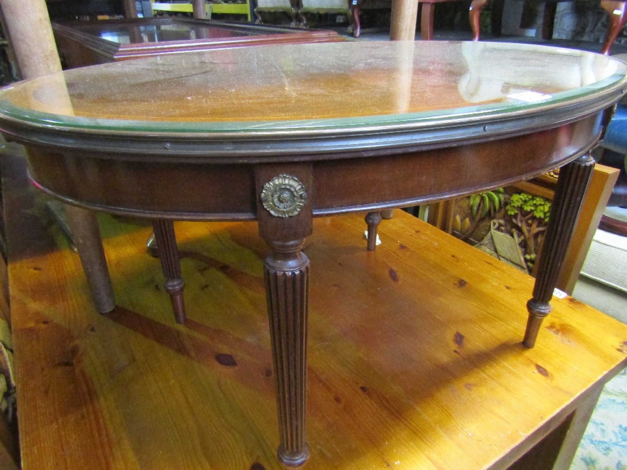 Appraisal: A reproduction mahogany occasional table of oval form in the