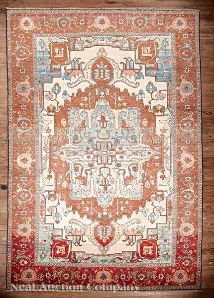 Appraisal: A Persian Serapi Carpet cream and cinnamon ground large central