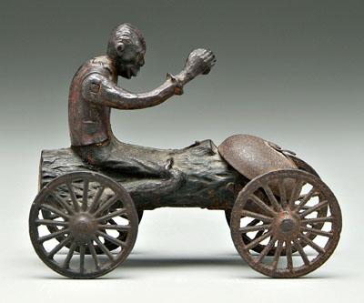 Appraisal: Pull toy black man riding log hand lowers to ring