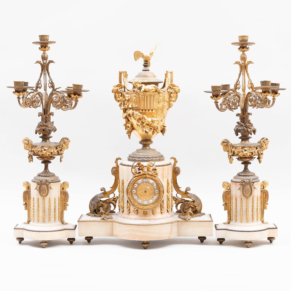 Appraisal: Louis XVI Style Ormolu-Mounted Onyx Three Piece Garniture Comprising a