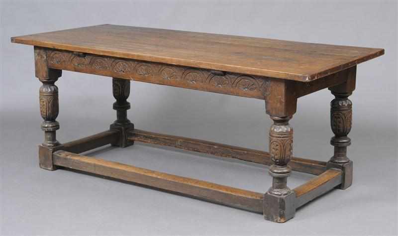 Appraisal: ELIZABETHAN STYLE CARVED OAK REFECTORY TABLE The six-plank top with