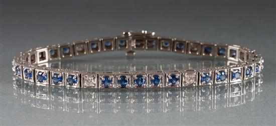 Appraisal: K white gold diamond and sapphire flexible link bracelet diamonds