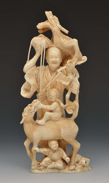 Appraisal: A JAPANESE OKIMONO in walrus ivory a standing figure of