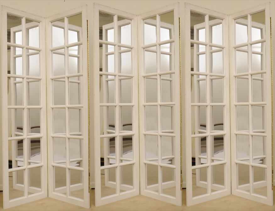 Appraisal: THREE DECORATIVE IVORY-PAINTED AND MIRROR GLASS TWO-FOLD SCREENS Each fold