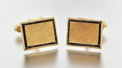 Appraisal: A Pair of Gold and Garnet Cufflinks by Lucien Piccard