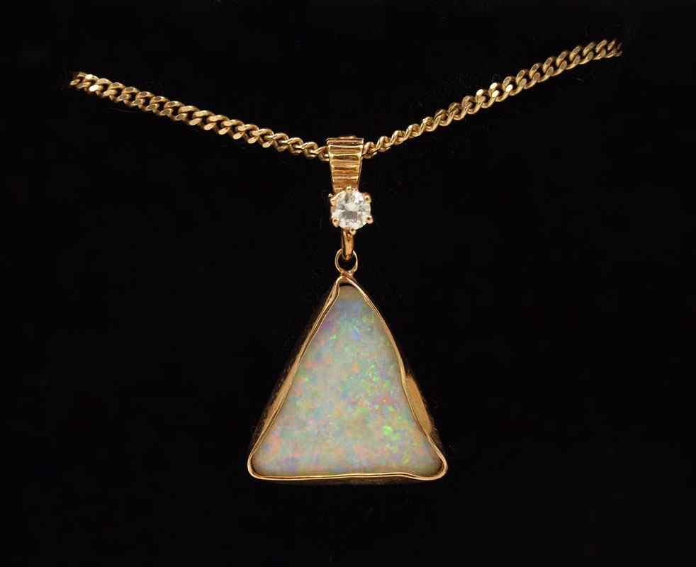 Appraisal: K OPAL DIAMOND PENDANT NECKLACE K yellow gold pendant contains