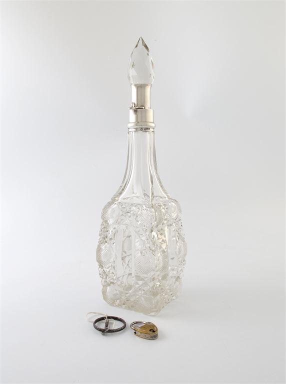 Appraisal: An Edwardian silver mounted lockable decanter