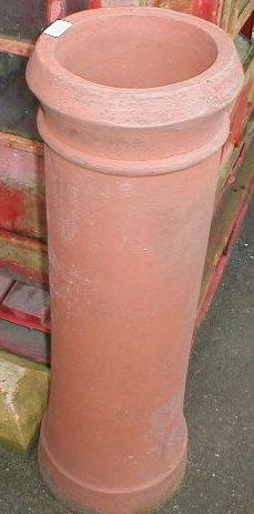 Appraisal: A stone ball gatepost finial and a chimney pot