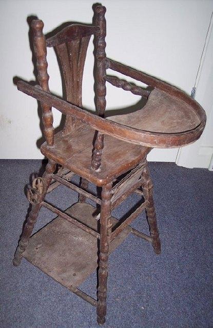 Appraisal: A doll's turned wood high chair with folding mechanism and