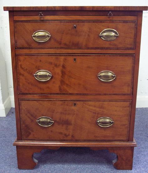 Appraisal: An early th Century mahogany chest fitted a brushing slide