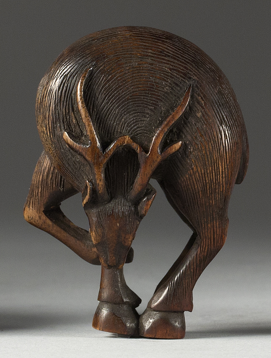 Appraisal: WOOD NETSUKE th CenturyIn the form of a grazing stag