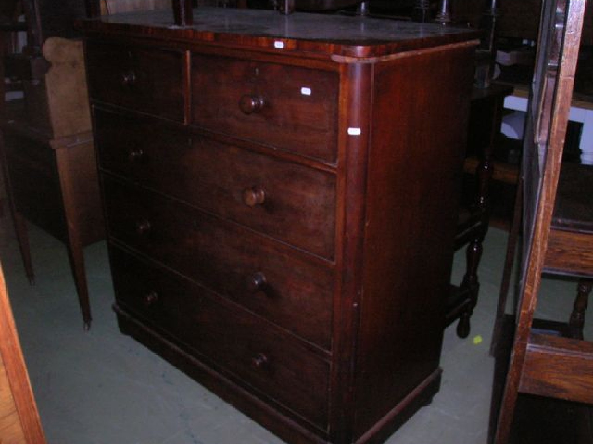 Appraisal: A mid Victorian mahogany bedroom chest of three long and