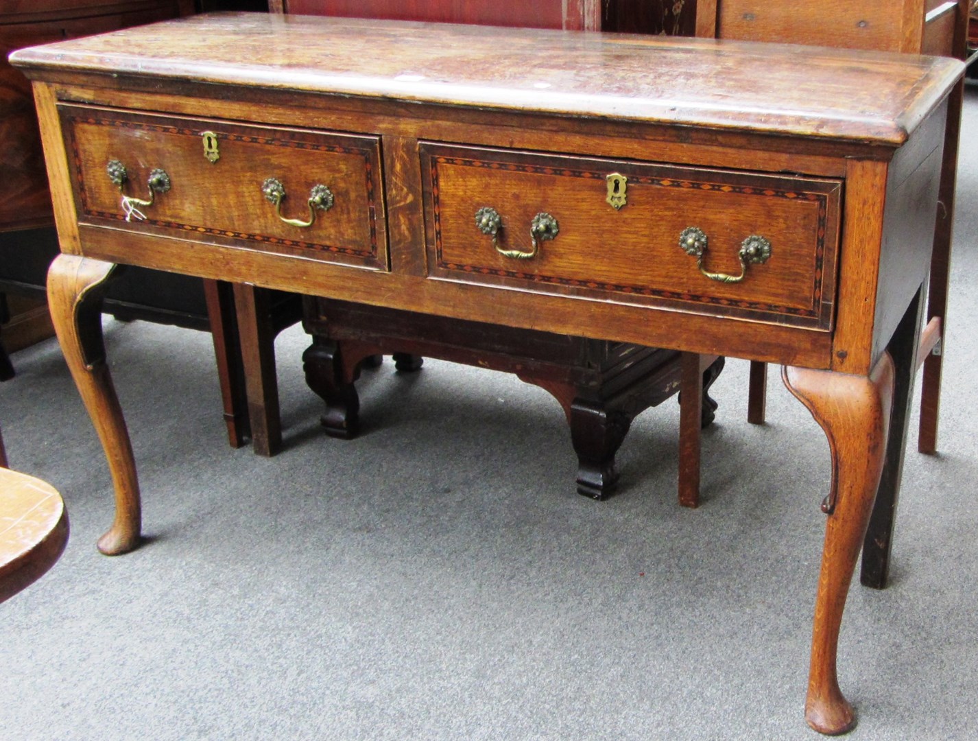 Appraisal: An th century inlaid oak small dresser with a pair