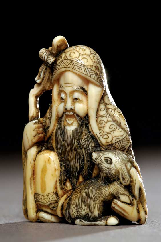 Appraisal: ANTIQUE IVORY NETSUKE Well carved and detailed antique ivory netsuke