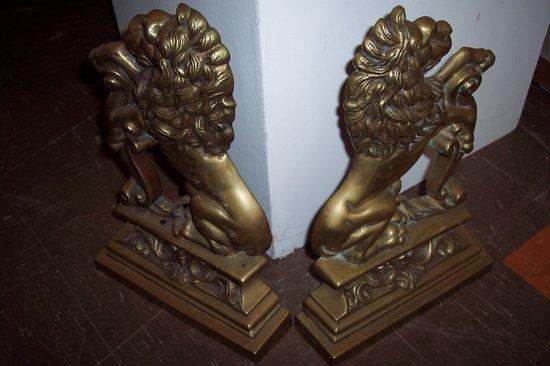 Appraisal: A pair of brass lion door stops cm high