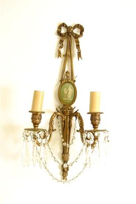 Appraisal: A pair of gilt brass twin branch wall lights in