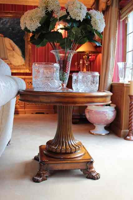 Appraisal: A REGENCY STYLE CIRCULAR LEATHER INSET LIBRARY TABLE on reeded