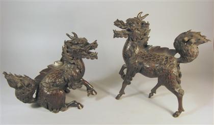 Appraisal: Pair Japanese bronze Kirin th century Heavy sectional casting depicts