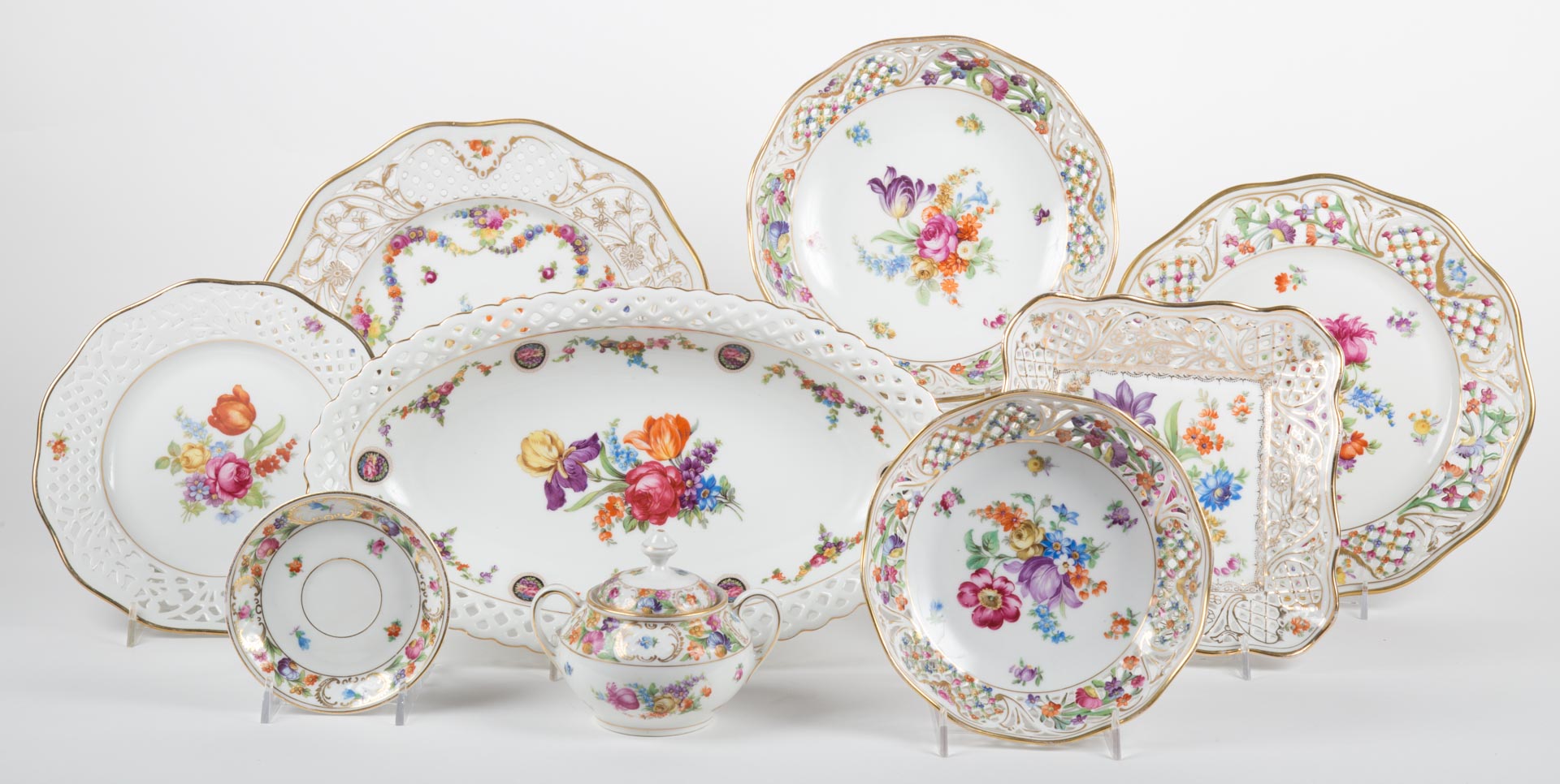 Appraisal: Schumann porcelain partial dessert service floral painted reticulated border service