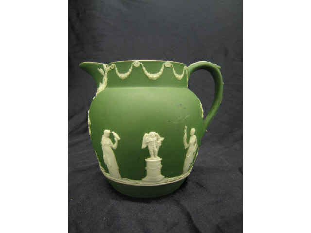 Appraisal: Wedgwood Dark Green Jasperware Milk Pitcher classical maiden cherub scene