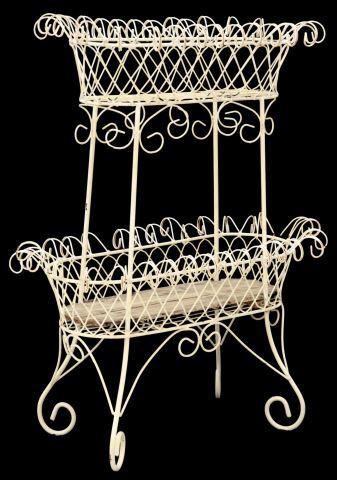 Appraisal: Wrought iron two-tier basket stand worked in a diamond and