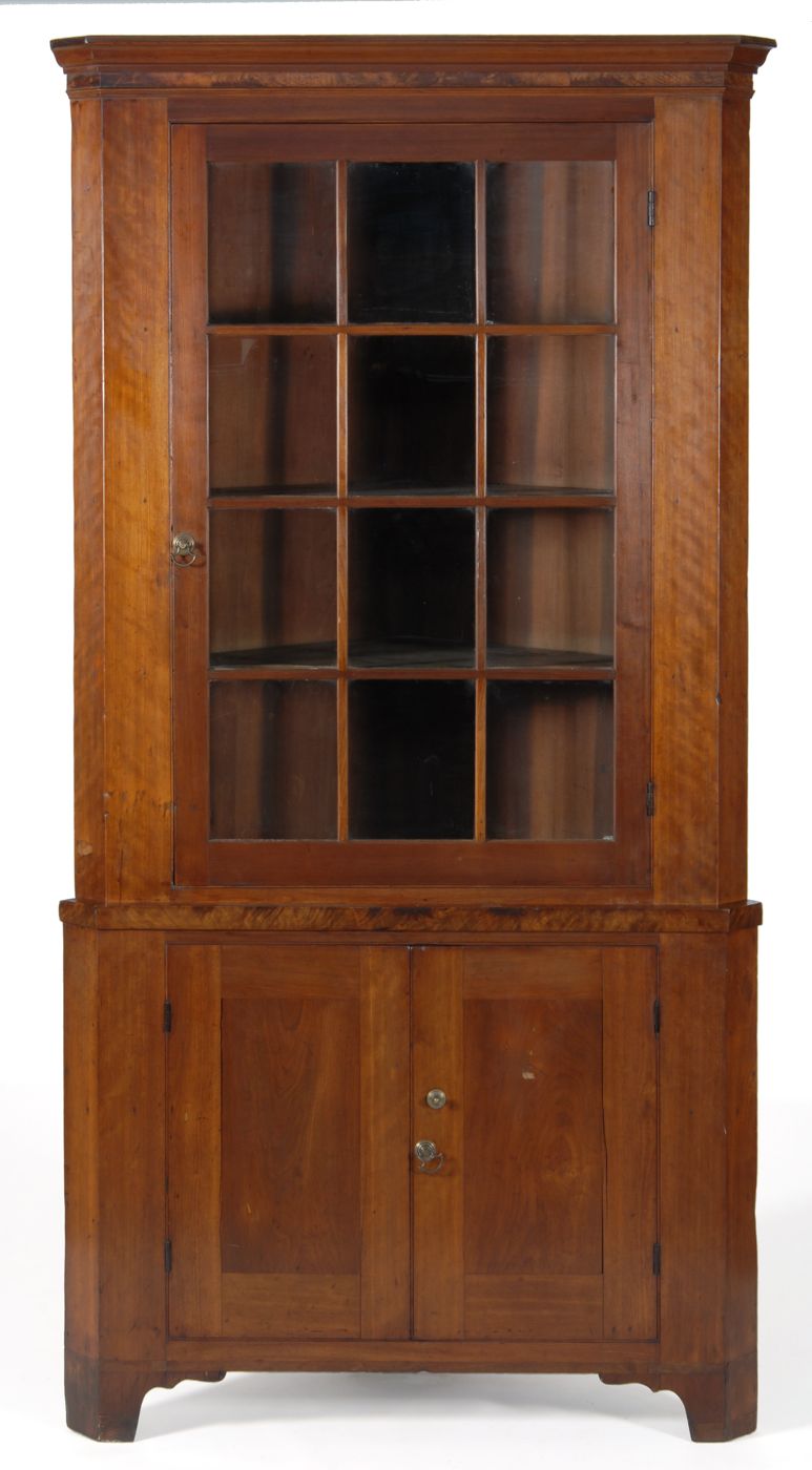 Appraisal: ANTIQUE AMERICAN TWO-PART CORNER CUPBOARD Circa In cherry with crotch