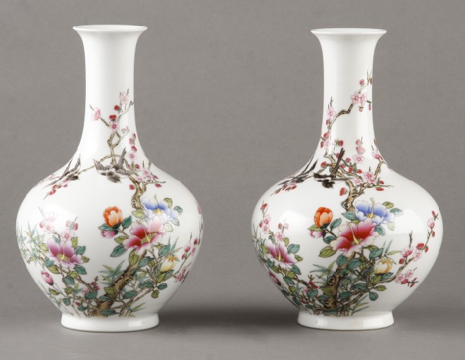 Appraisal: Vases feature flower butterfly and bird motif white ground Chinese