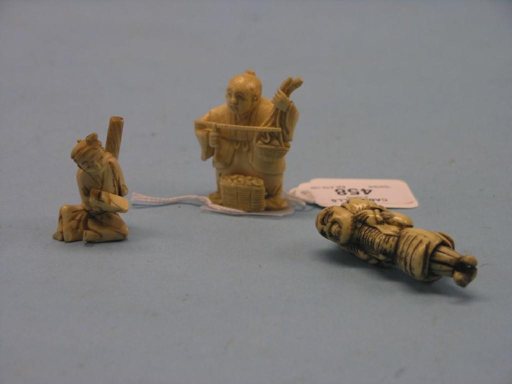 Appraisal: Two Japanese carved ivory figural netsuke male labourers one signed