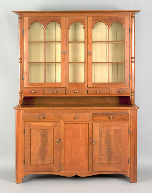 Appraisal: Pennsylvania walnut Dutch cupboard ca with a molded cornice over