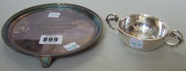 Appraisal: A silver circular waiter decorated with a beaded rim and