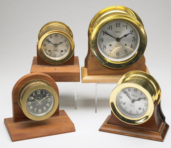 Appraisal: CHELSEA SHIP S CLOCKS Grouping of four brass case clocks