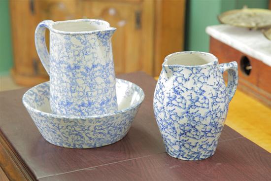 Appraisal: THREE PIECES OF BLUE WHITE SPONGE POTTERY Including two pitchers