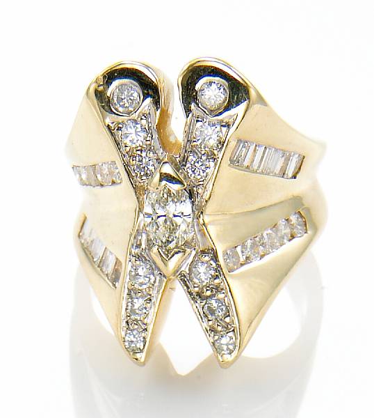 Appraisal: A diamond and k gold ring in a scissor motif