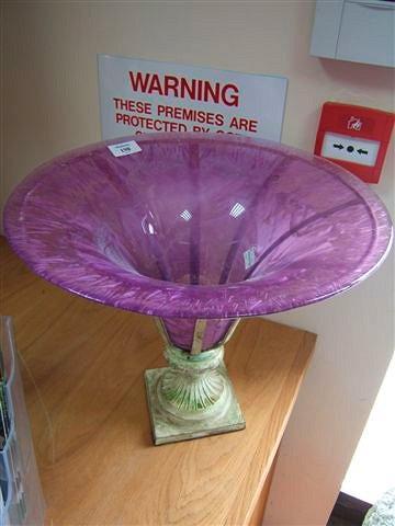 Appraisal: A purple glass vase or table centre of trumpet form