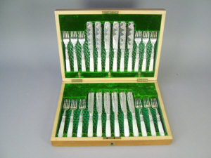 Appraisal: A cased set of silver plated fruit knives and forks