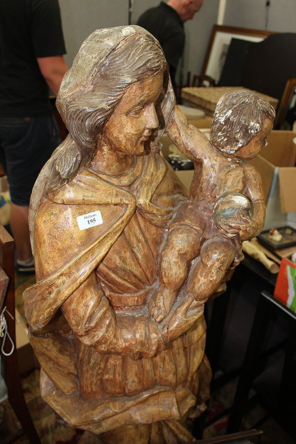 Appraisal: A PAINTED CARVED WOODEN SCULPTURE OF THE VIRGIN MARY wearing