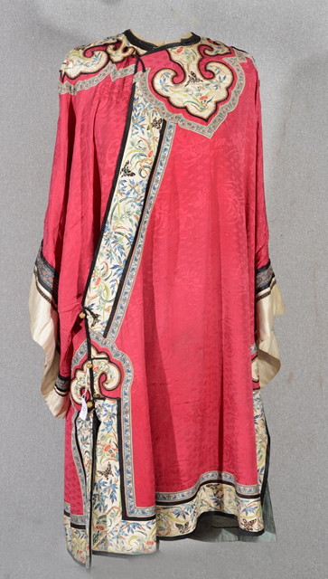 Appraisal: A CHINESE RED SILK COAT with embroidered panels of butterflies