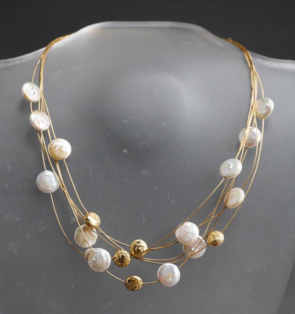 Appraisal: -KARAT YELLOW GOLD AND FRESHWATER BUTTON PEARL SIX-STRAND NECKLACE GROSS