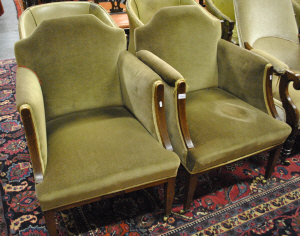 Appraisal: A pair of inlaid mahogany armchairs upholstered and covered in