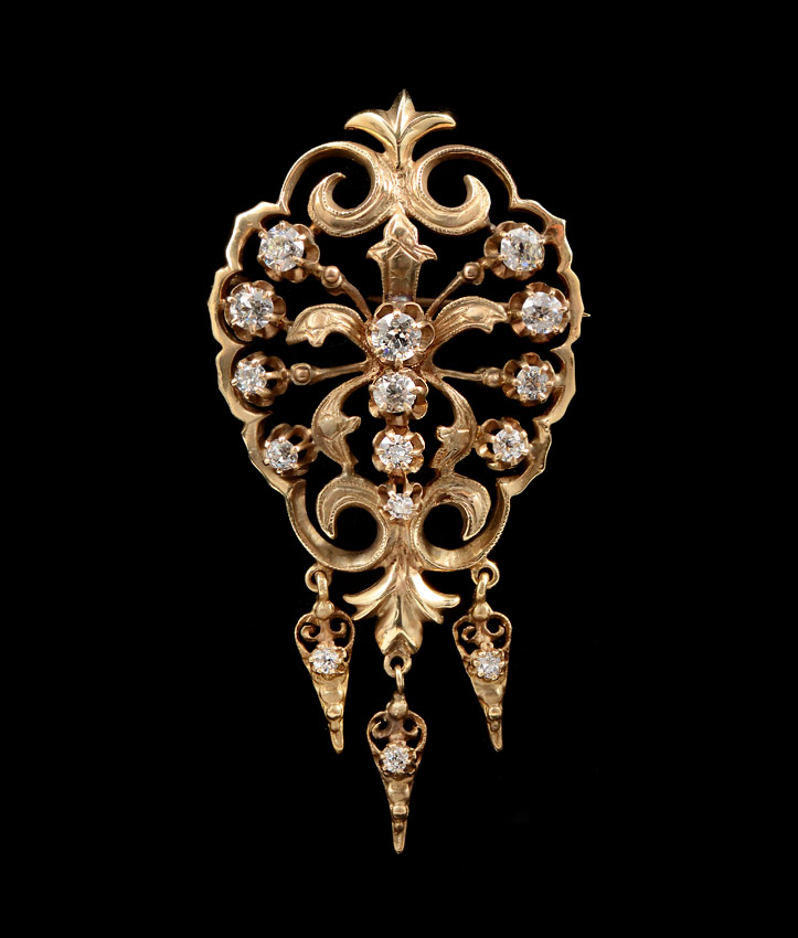 Appraisal: EDWARDIAN DIAMOND BROOCH K yellow gold open scroll work brooch