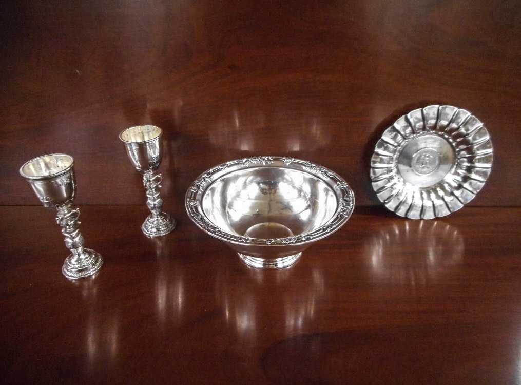 Appraisal: FOUR STERLING SILVER HOLLOWWARE AND STEMWARE PIECES pair of British