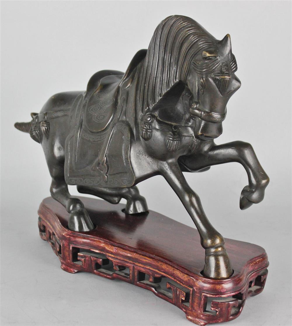 Appraisal: CHINESE BRONZE MODEL OF A HORSE cast as a Tang