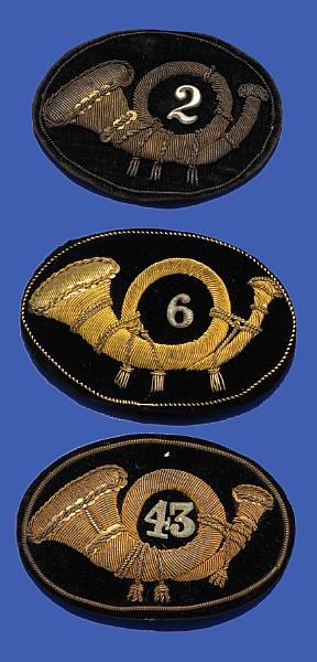 Appraisal: A group of three Pattern Infantry officer's embroidered insignia The