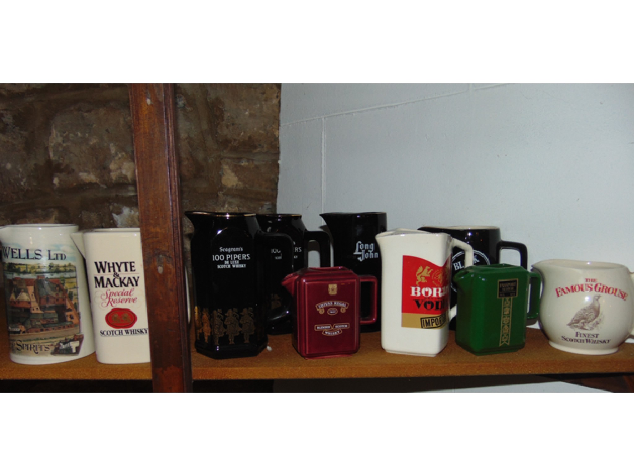 Appraisal: A collection of pub related jugs including examples for Passport