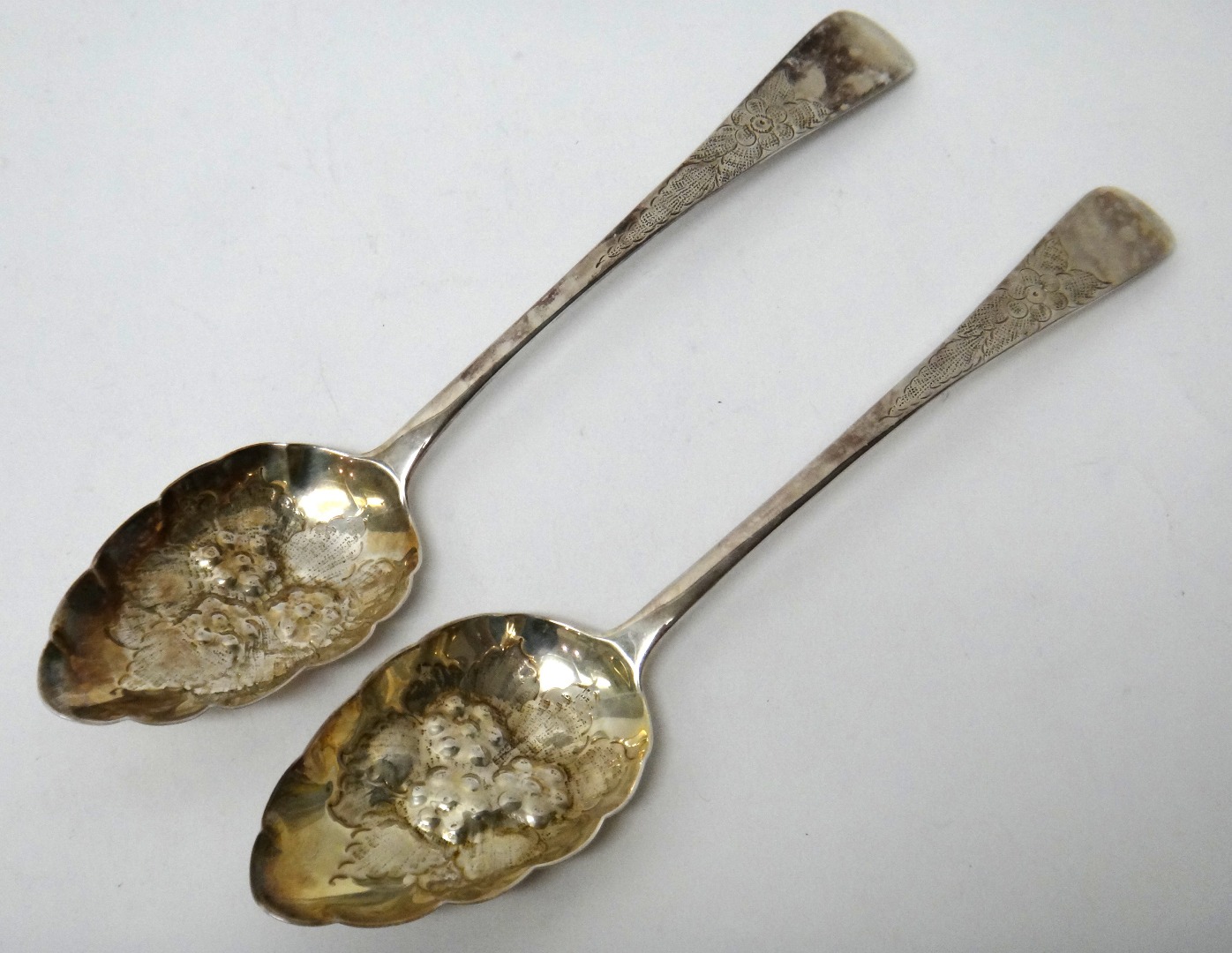 Appraisal: A pair of silver berry fruit serving spoons with later