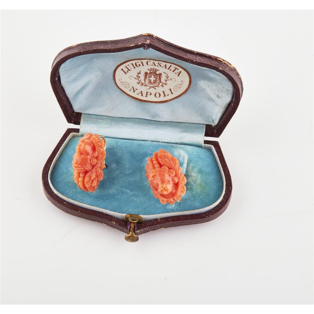 Appraisal: A pair of Italian mid- th century carved coral ear