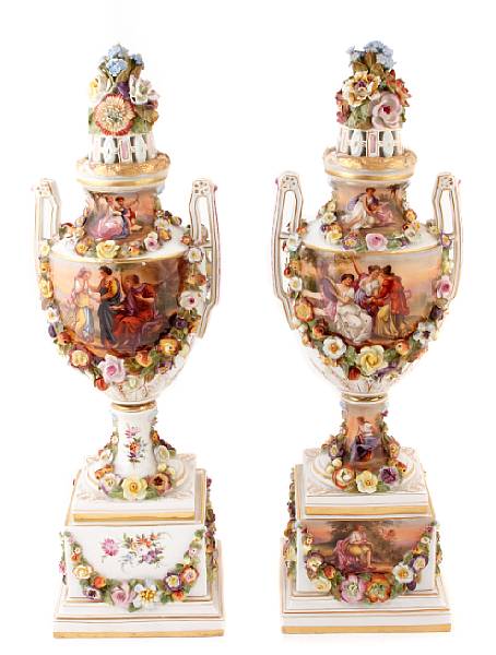 Appraisal: A pair of Continental porcelain covered urns floral encrusted and